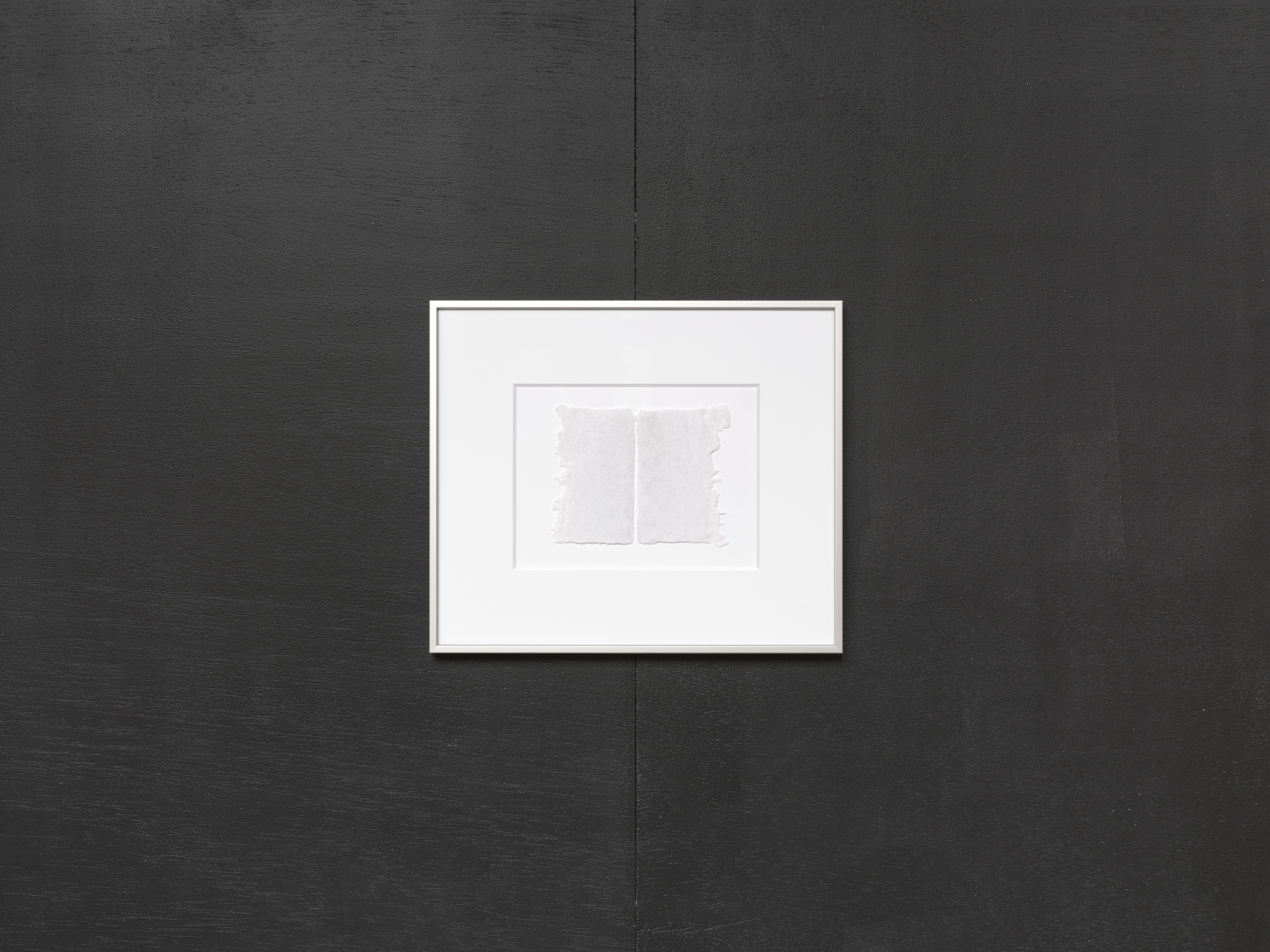 Aisha Altenhofen solo exhibition at Austin Space: Installation view of two white grid light fixtures installed at the wall, with an empty white wall between them.